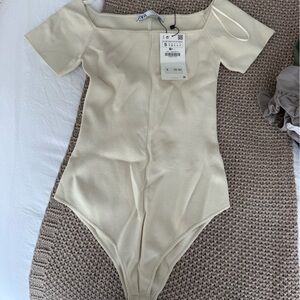 Elegant Cream Off-Shoulder Bodysuit